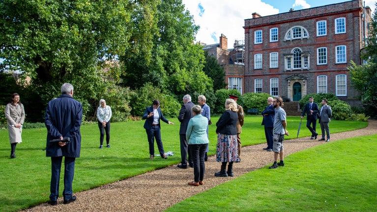 His Royal Highness The Duke of Gloucester standing on the lawn behind Peckover House meeting members of Active Fenland